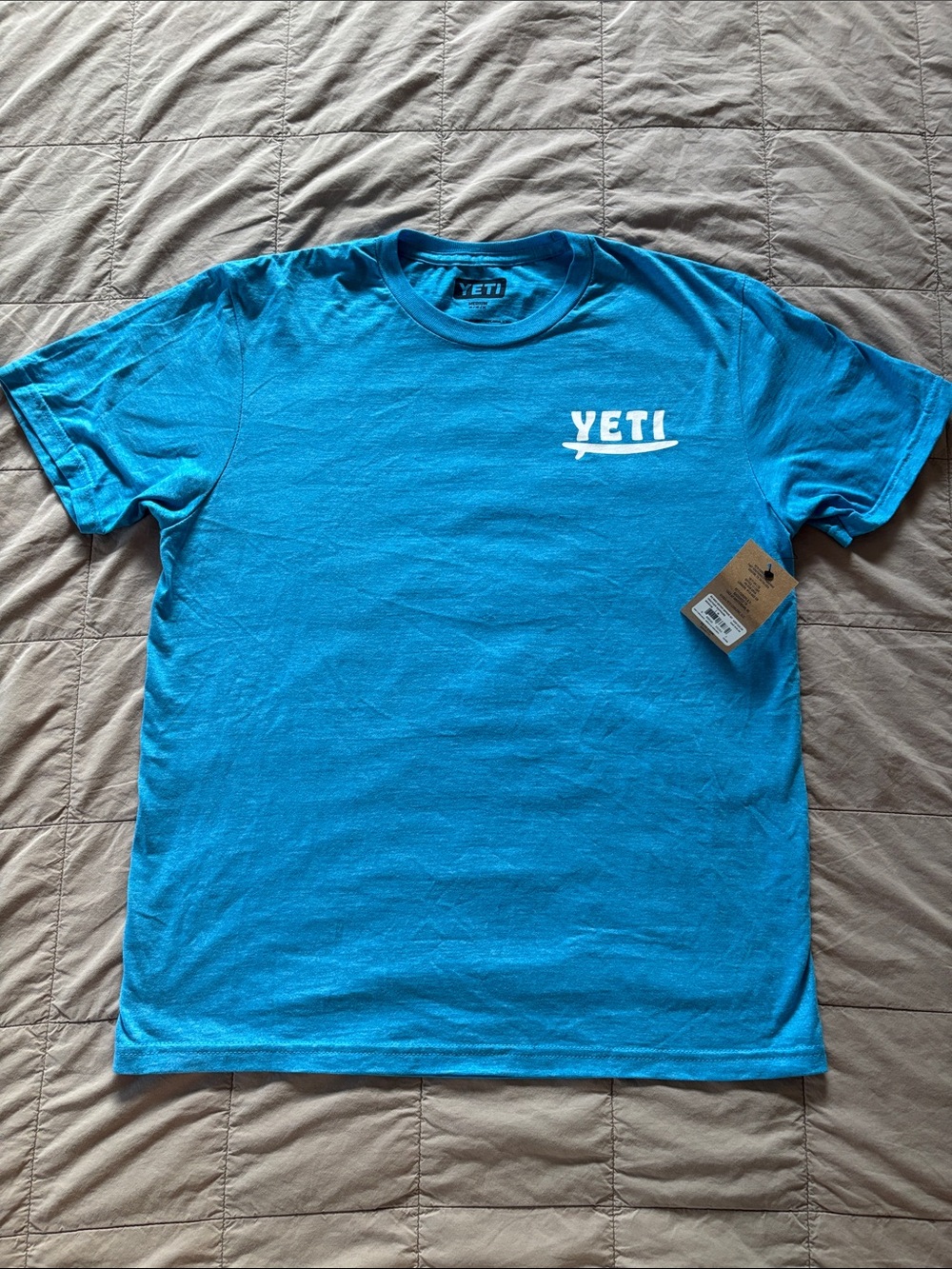 Yeti Men’s Short Sleeve Tee in Bright Teal Blue with White Logo